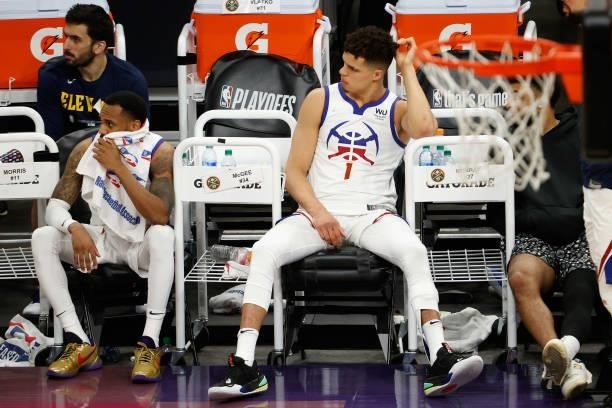Michael Porter Jr. #1 and Monte Morris of the Denver Nuggets react on the bench during the final moments in Game Two of the Western Conference...