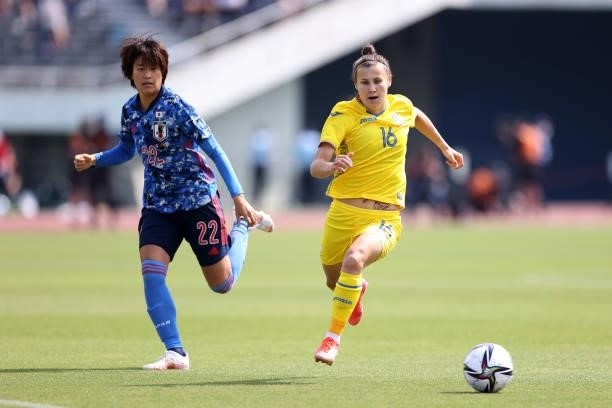 Olha Ovdiychuk of Ukraine controls the ball under pressure of Saori Takarada of Japan during the women's international friendly match between Japan...