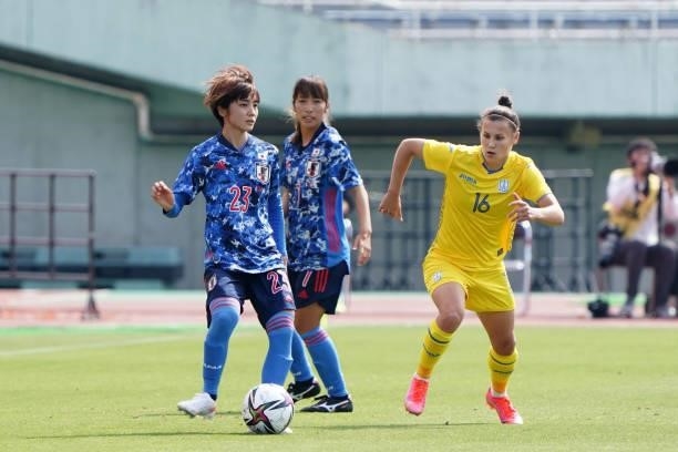 Nanami Kitamura of Japan controls the ball under pressure of Olha Ovdiychuk of Ukraine during the women's international friendly match between Japan...