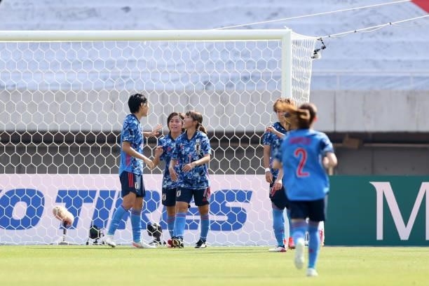 Mana Iwabuchi of Japan celebrates scoring her side's second goal with her team mates during the women's international friendly match between Japan...