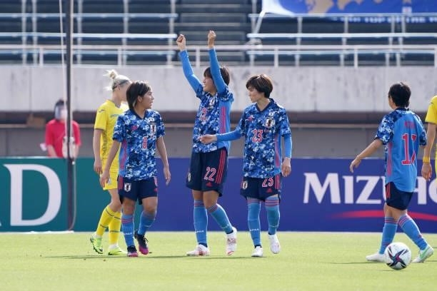 Saori Takarada of Japan celebrates scoring her side's third goal with her team mates during the women's international friendly match between Japan...