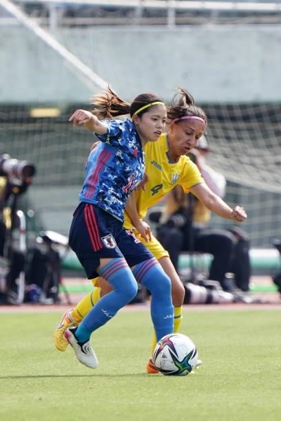 Yui Hasegawa of Japan controls the ball under pressure of Anastasiia Filenko of Ukraine during the women's international friendly match between Japan...