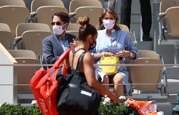 Pregnant Ophelie Meunier and husband Mathieu Vergne applaud Maria Sakkari of Greece during day 11 of the 2021 Roland-Garros, French Open, a Grand...