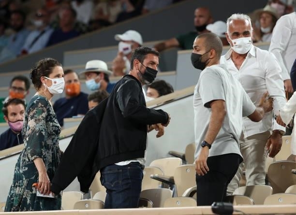 Robert Pires and his wife Jessica , Tony Parker, Mansour Bahrami attend the night session of day 11 of the 2021 Roland-Garros, French Open, a Grand...