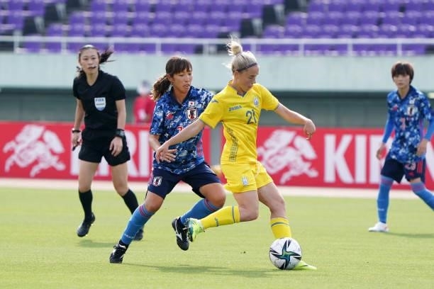 Iryna Kochnieva of Ukraine controls the ball under pressure of Emi Nakajima of Japan during the women's international friendly match between Japan...