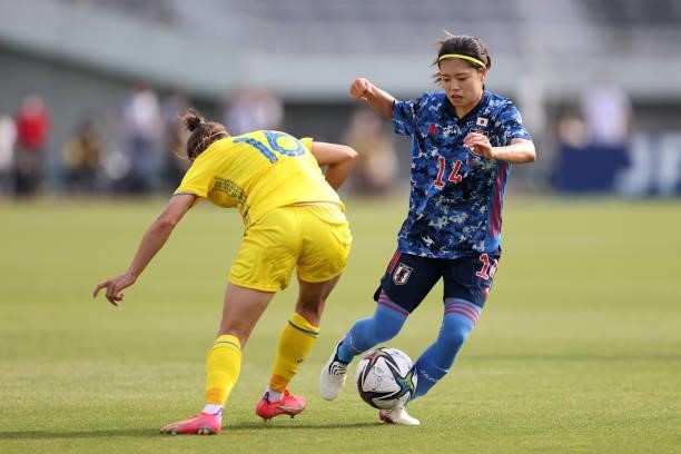 Yui Hasegawa of Japan takes on Olha Ovdiychuk of Ukraine during the women's international friendly match between Japan and Ukraine at Edion Stadium...