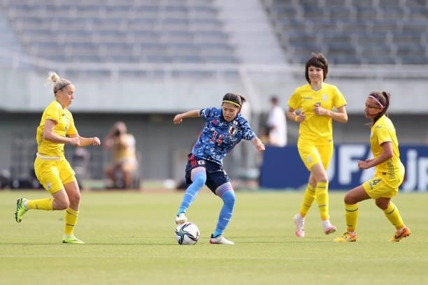Yui Hasegawa of Japan controls the ball under pressure of Ukraine defense during the women's international friendly match between Japan and Ukraine...