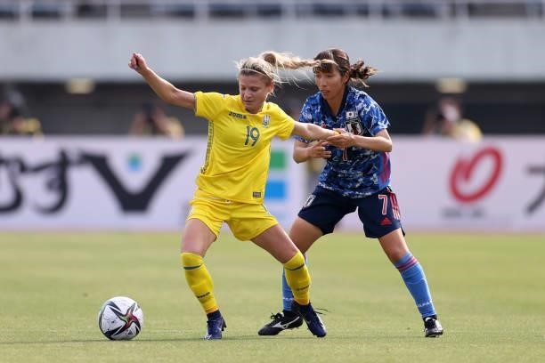 Ganna Voronina of Ukraine controls the ball under pressure of Emi Nakajima of Japan during the women's international friendly match between Japan and...