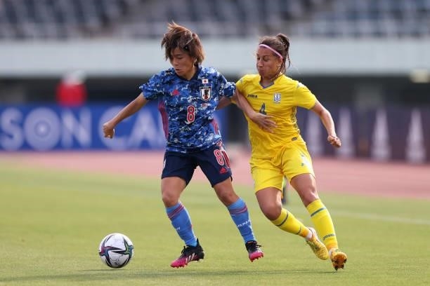 Mana Iwabuchi of Japan and Anastasiia Filenko of Ukraine compete for the ball during the women's international friendly match between Japan and...