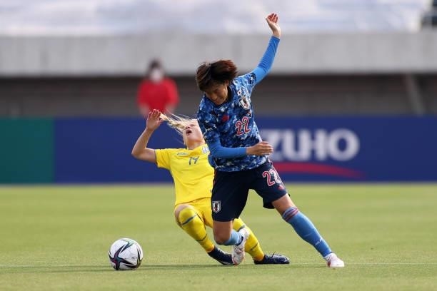 Saori Takarada of Japan and Ganna Voronina of Ukraine compete for the ball during the women's international friendly match between Japan and Ukraine...