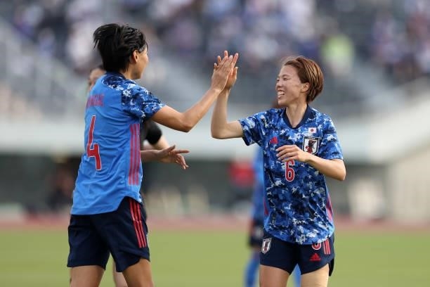 Hina Sugita of Japan celebrates scoring her side's sixth goal with her team mate Saki Kumagai during the women's international friendly match between...
