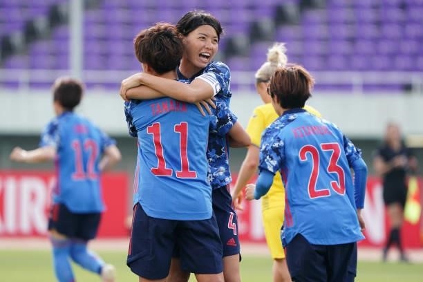 Mina Tanaka of Japan celebrates scoring her side's seventh goal with her team mate Saki Kumagai during the women's international friendly match...