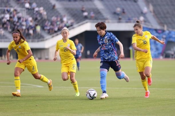 Jun Endo of Japan controls the ball under pressure of Ukraine defense during the women's international friendly match between Japan and Ukraine at...