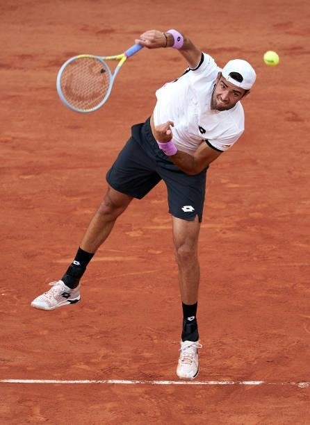 Matteo Berrettini of Italy serves in his Quarter Final match against Novak Djokovic of Serbia during day eleven of the 2021 French Open at Roland...