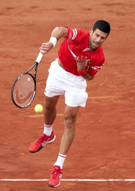 Novak Djokovic of Serbia serves in his Quarter Final match against Matteo Berrettini of Italy during day eleven of the 2021 French Open at Roland...