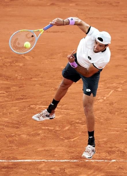 Matteo Berrettini of Italy serves in his Quarter Final match against Novak Djokovic of Serbia during day eleven of the 2021 French Open at Roland...