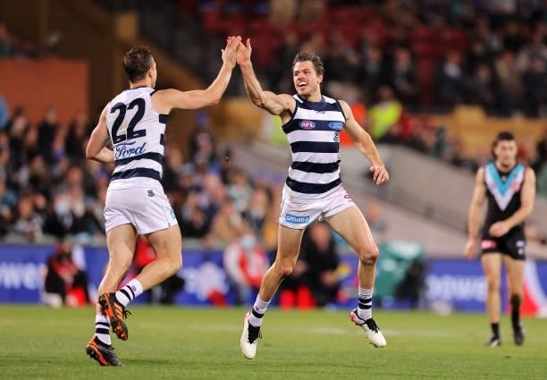 Mitch Duncan of the Cats and Isaac Smith of the Cats celebrate during the round 13 AFL match between the Port Adelaide Power and the Geelong Cats at...