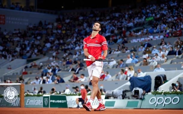 Novak Djokovic of Serbia reacts in his Quarter Final match against Matteo Berrettini of Italy during day eleven of the 2021 French Open at Roland...