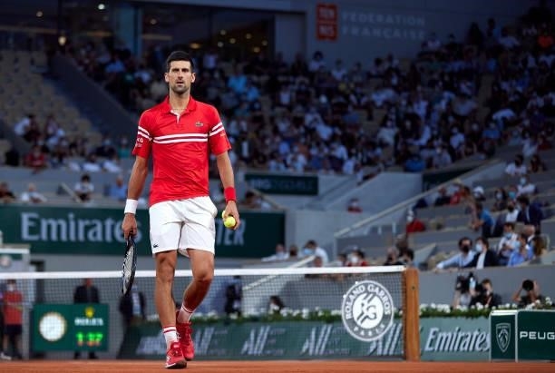 Novak Djokovic of Serbia looks on in his Quarter Final match against Matteo Berrettini of Italy during day eleven of the 2021 French Open at Roland...