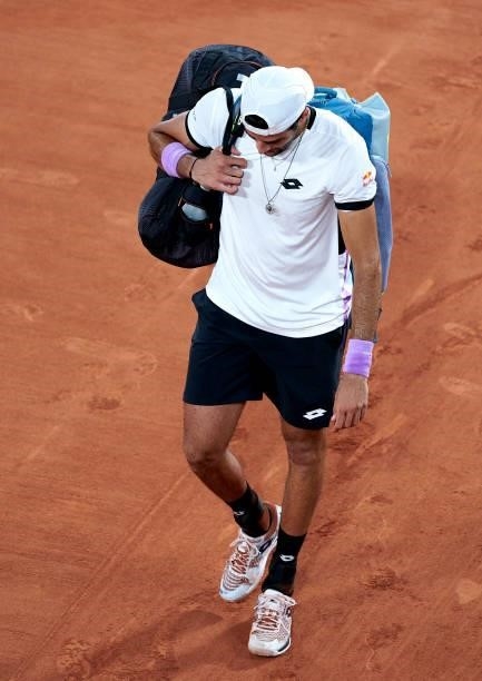 Matteo Berrettini of Italy leaves the court following defeat in his Quarter Final match against Novak Djokovic of Serbia during day eleven of the...