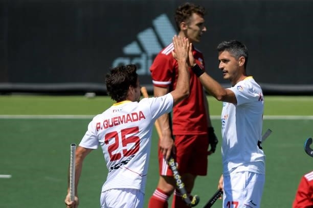 Xavi Lleonart of Spain celebrates with Pau Quemada of Spain after scoring his sides third goal during the Euro Hockey Championships match between...