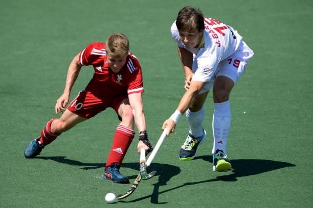 Rhodri Furlong of Wales and Jose Basterra of Spain battle for possession during the Euro Hockey Championships match between Spain and Wales at...