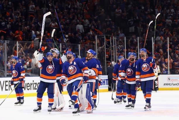 The New York Islanders celebrate their 6-2 victory over the Boston Bruins in Game Six of the Second Round of the 2021 NHL Stanley Cup Playoffs at the...