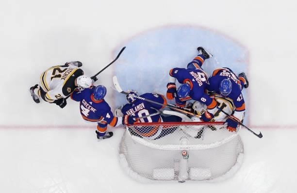 The New York Islanders trap Chris Wagner of the Boston Bruins in the net in Game Six of the Second Round of the 2021 NHL Stanley Cup Playoffs at the...