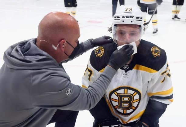 Charlie McAvoy of the Boston Bruins is cut during the second period by in Game Six of the Second Round of the 2021 NHL Stanley Cup Playoffs at the...