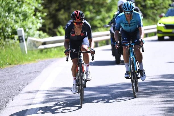 Richard Carapaz of Ecuador and Team INEOS Grenadiers & Jakob Fuglsang of Denmark and Team Astana – Premier Tech during the 84th Tour de Suisse 2021,...