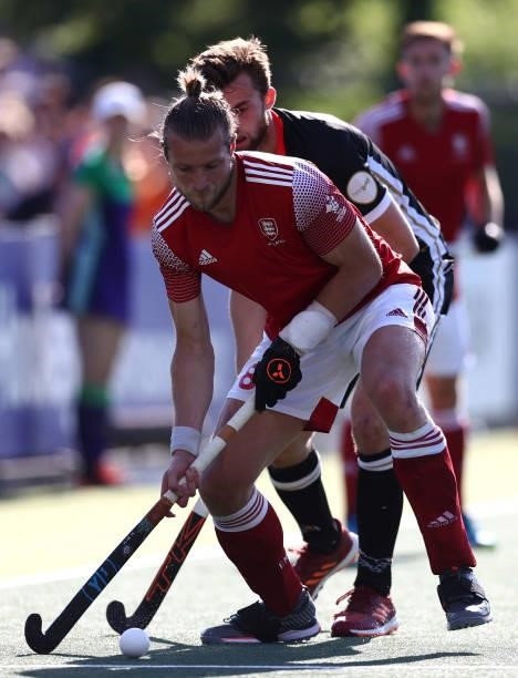 Brendan Creed of England battles for the ball with Constantin Staib of Germany during the Euro Hockey Championships Mens Semi Final match between...