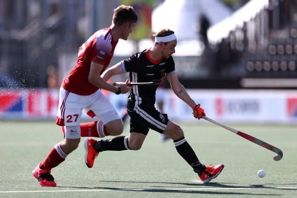 Liam Sanford of England battles for the ball with Christopher Ruehr of Germany during the Euro Hockey Championships Mens Semi Final match between...