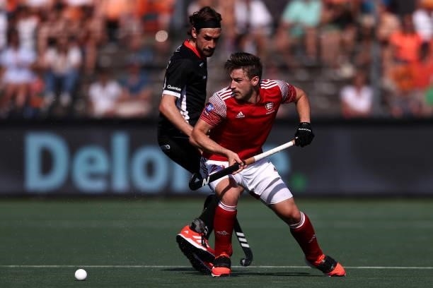 Liam Ansell of England battles for the ball with Florian Fuchs of Germany during the Euro Hockey Championships Mens Semi Final match between England...