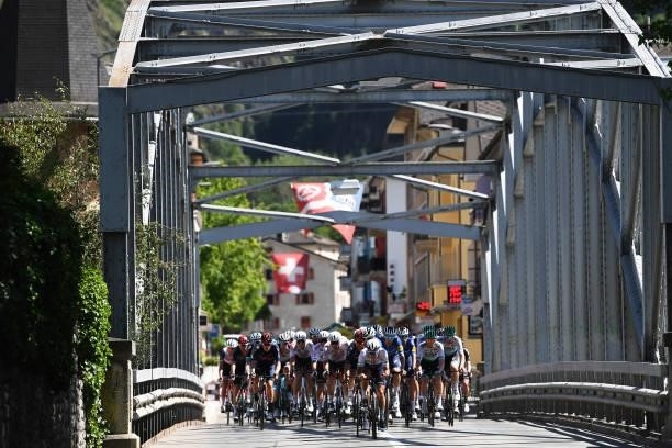 The Peloton passing through a bridge in Chippis Village during the 84th Tour de Suisse 2021, Stage 5 a 175,2km stage from Gstaad to Leukerbad 1385m /...