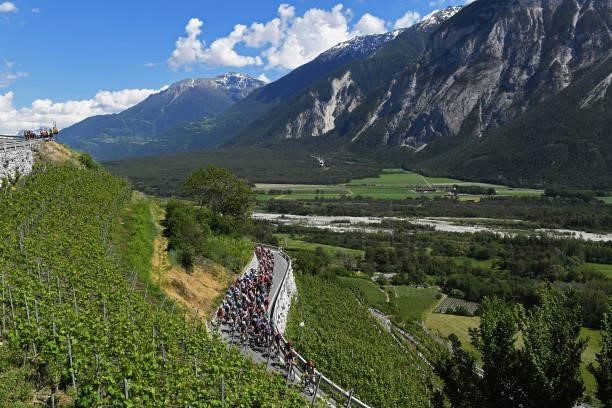 The Peloton passing through Varen during the 84th Tour de Suisse 2021, Stage 5 a 175,2km stage from Gstaad to Leukerbad 1385m / Vineyards / Landscape...