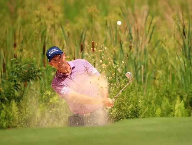 Padraig Harrington of Ireland plays his shot out of the bunker on the 10th hole during the first round of the Palmetto Championship at Congaree on...