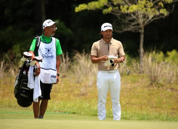 Satoshi Kodaira of Japan prepares to play his shot on the 11th green during the first round of the Palmetto Championship at Congaree on June 10, 2021...