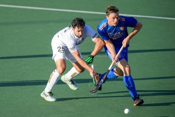 Loick Luypaert of Belgium battles for possession with Jorrit Croon of the Netherlands during the Euro Hockey Championships match between Netherlands...