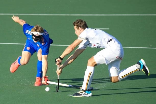 Jip Janssen of the Netherlands battles for possession with Gauthier Boccard of Belgium during the Euro Hockey Championships match between Netherlands...