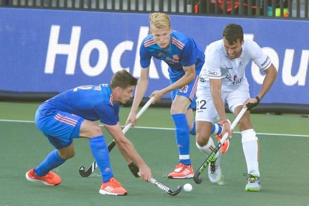 Simon Gougnard of Belgium battles for possession with Sander de Wijn of the Netherlands and Joep de Mol of the Netherlands during the Euro Hockey...