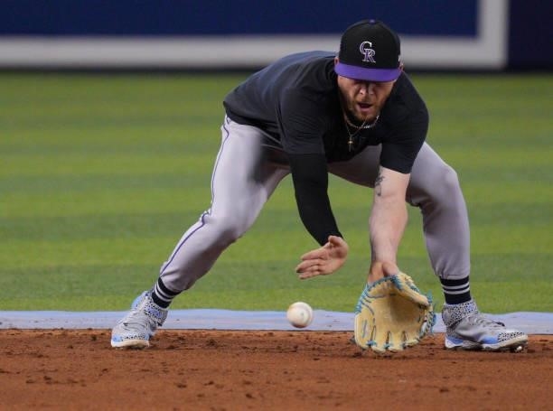 Trevor Story of the Colorado Rockies fields the ball during live batting practice prior to the game against the Miami Marlins at loanDepot park on...
