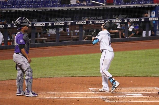 Adam Duvall of the Miami Marlins celebrates at home plate after hitting a two-run home run in the second inning against the Colorado Rockies at...