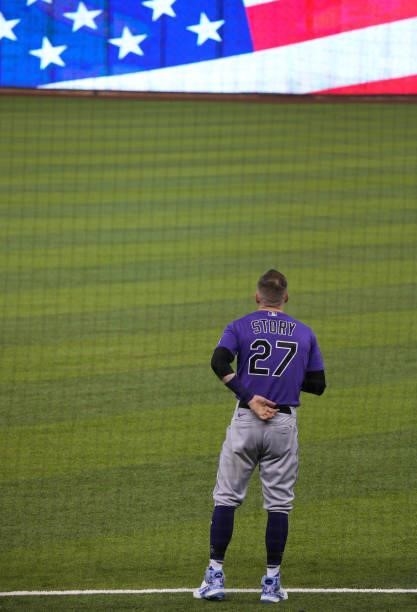 Trevor Story of the Colorado Rockies stands during the National Anthem prior to the game against the Miami Marlins at loanDepot park on June 10, 2021...