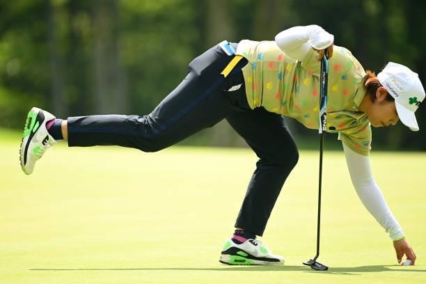 Mayu Hamada of Japan picks her ball up after the birdie on the 13th green during the second round of the Ai Miyazato Suntory Ladies Open at Rokko...