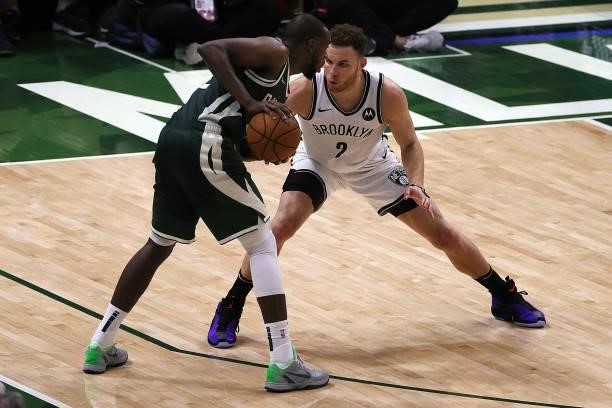 Khris Middleton of the Milwaukee Bucks is defended by Blake Griffin of the Brooklyn Nets during the second half of Game Three of the Eastern...