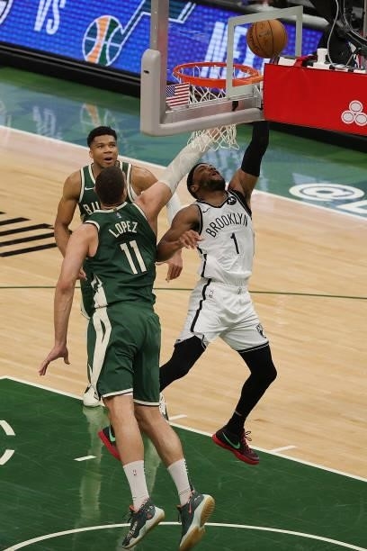 Bruce Brown of the Brooklyn Nets drives to the basket against Brook Lopez of the Milwaukee Bucks during the second half of Game Three of the Eastern...