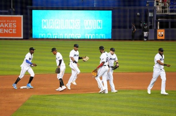 The Miami Marlins celebrate their 11-4 win after a game against the Colorado Rockies at loanDepot park on June 10, 2021 in Miami, Florida.