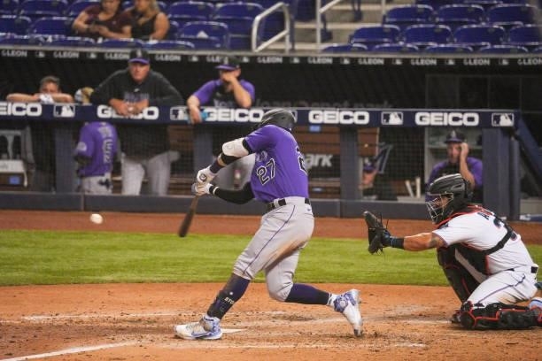 Trevor Story of the Colorado Rockies singles in the seventh inning against the Miami Marlins at loanDepot park on June 10, 2021 in Miami, Florida.