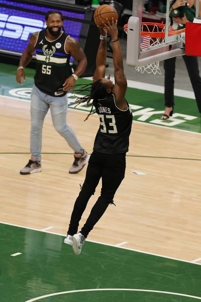 Aaron Jones of the Green Bay Packers attempts a dunk following Game Three of the Eastern Conference second round playoff series between the Milwaukee...