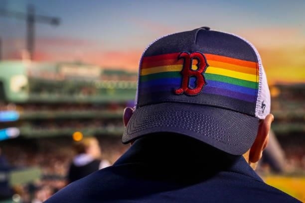 Fan wears a Boston Red Sox pride themed hat on Pride Night during a game against the Houston Astros at Fenway Park on June 10, 2021 in Boston,...